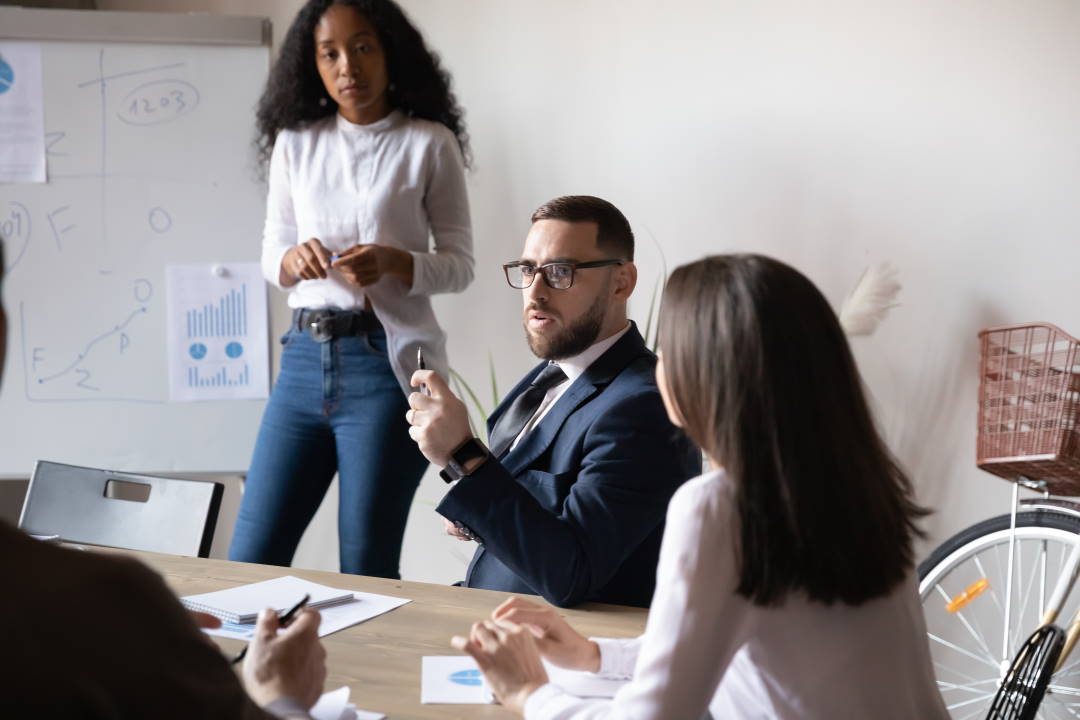 Focused leader, listens to his peers during a valuable meeting.